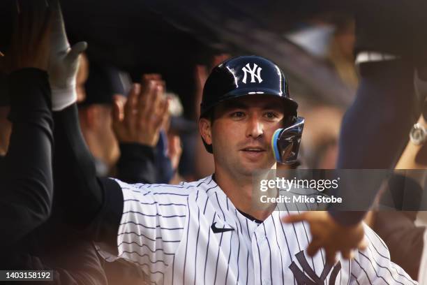 Kyle Higashioka of the New York Yankees celebrates after hitting 3-run home run in the fifth inning against the Tampa Bay Rays at Yankee Stadium on...