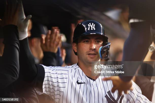 Kyle Higashioka of the New York Yankees celebrates after hitting 3-run home run in the fifth inning against the Tampa Bay Rays at Yankee Stadium on...