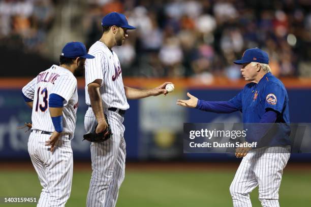 David Peterson of the New York Mets hands the ball to manager Buck Showalter as he is removed from the game during the fifth inning of the game...