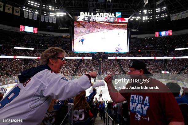 Fans celebrate after the Colorado Avalanche score their 2nd goal against the Tampa Bay Lightning during the first period in Game One of the 2022...