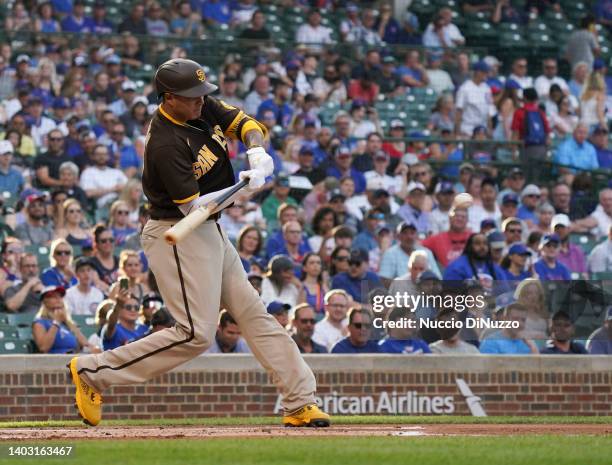 Manny Machado of the San Diego Padres hits his 1500th MLB career hit during the first inning of a game against the Chicago Cubs at Wrigley Field on...