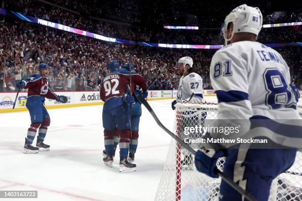 Artturi Lehkonen of the Colorado Avalanche celebrates with teammates after scoring goal against Andrei Vasilevskiy of the Tampa Bay Lightning during...