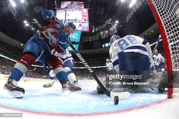 Gabriel Landeskog of the Colorado Avalanche scores a goal against Andrei Vasilevskiy of the Tampa Bay Lightning during the first period in Game One...