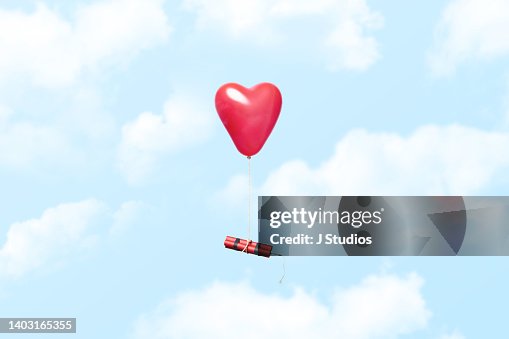 Heart shaped balloon carrying a dynamite stick Heart shaped balloon carrying a dynamite stick