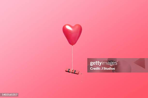 dangerous relationship concept image - blowing up balloon bildbanksfoton och bilder