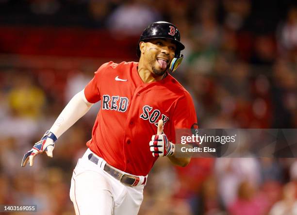 Xander Bogaerts of the Boston Red Sox celebrates his double in the eighth inning against the Oakland Athletics at Fenway Park on June 15, 2022 in...