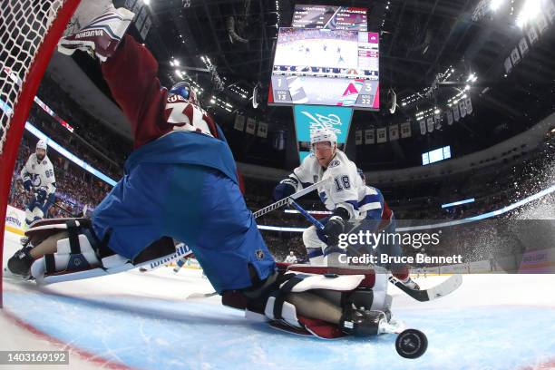 Ondrej Palat of the Tampa Bay Lightning scores against Darcy Kuemper of the Colorado Avalanche during the second period in Game One of the 2022...