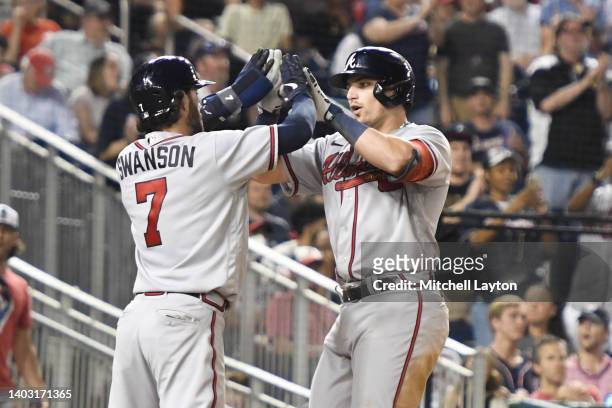 Austin Riley of the Atlanta Braves celebrates a two run home run with Dansby Swanson in the seventh inning during a baseball game against the...