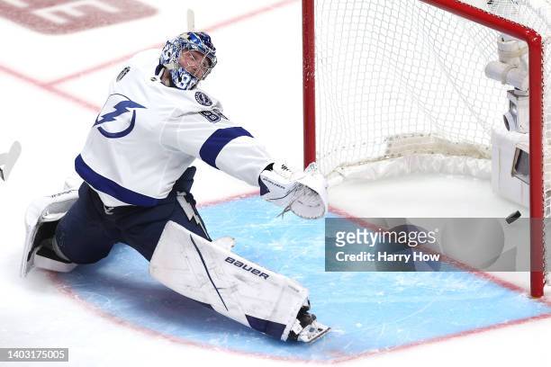 Andrei Vasilevskiy of the Tampa Bay Lightning has a goal scored against him by Andre Burakovsky of the Colorado Avalanche during overtime to win Game...