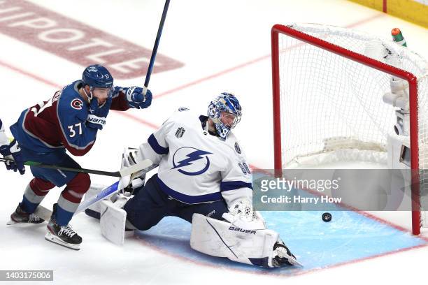 Andrei Vasilevskiy of the Tampa Bay Lightning has a goal scored against him by Andre Burakovsky of the Colorado Avalanche during overtime to win Game...