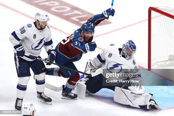 Compher of the Colorado Avalanche reacts after teammate Andre Burakovsky scores a goal against Andrei Vasilevskiy of the Tampa Bay Lightning during...