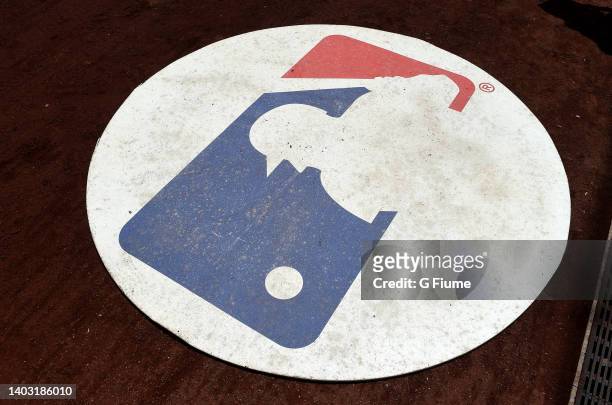 The MLB logo in the on deck circle during the game between the Washington Nationals and the Milwaukee Brewers at Nationals Park on June 12, 2022 in...