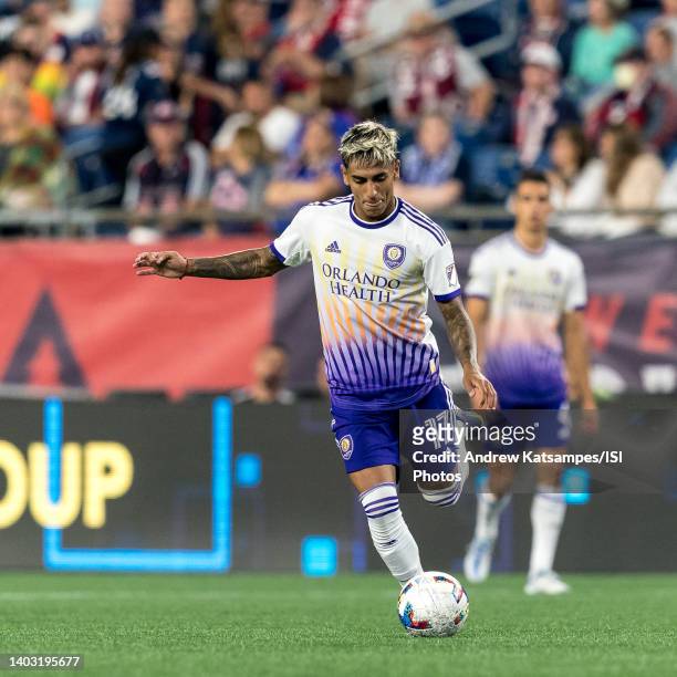 Facundo Torres of Orlando City passes the ball during a game between Orlando City SC and New England Revolution at Gillette Stadium on June 15, 2022...