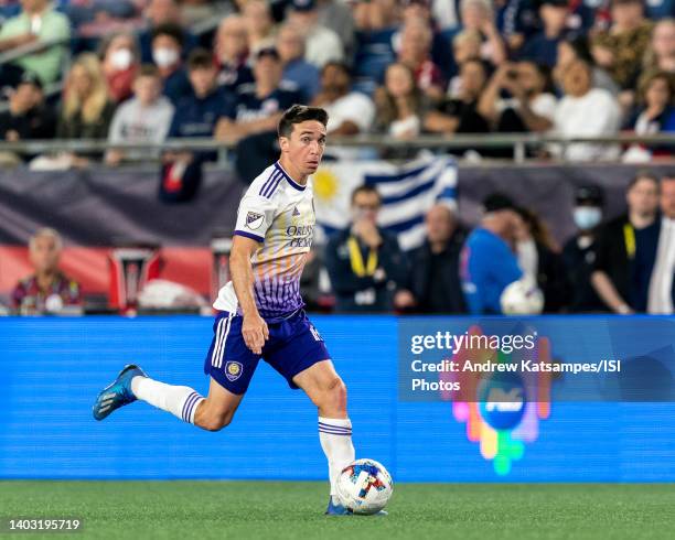 Mauricio Pereyra of Orlando City looks to pass during a game between Orlando City SC and New England Revolution at Gillette Stadium on June 15, 2022...