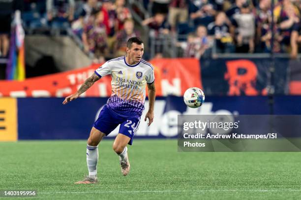 Kyle Smith of Orlando City passes the ball during a game between Orlando City SC and New England Revolution at Gillette Stadium on June 15, 2022 in...