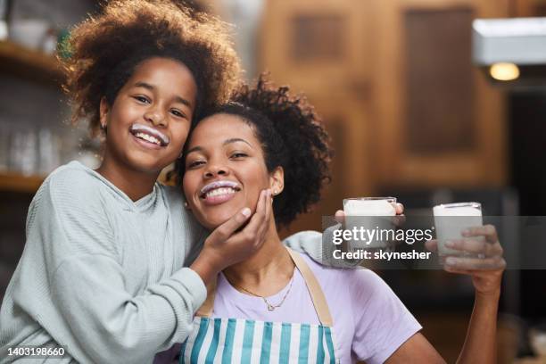 we both have milk mustache! - child drinking glass milk stock pictures, royalty-free photos & images