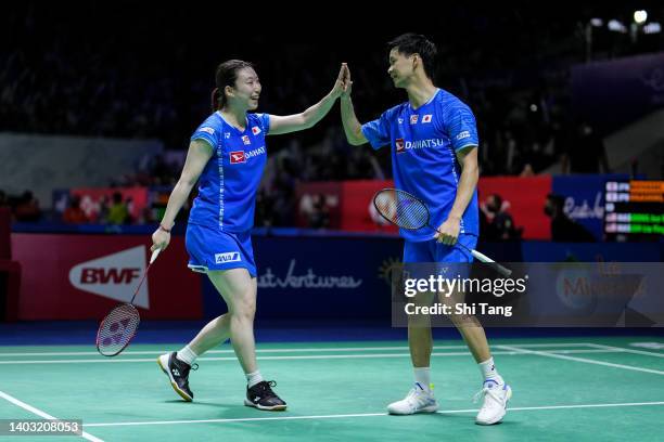 Yuta Watanabe and Arisa Higashino of Japan celebrate the victory in the Mixed Doubles Second Round match against Soong Joo Ven and Goh Liu Ying of...