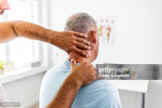 neck pain medical exam - osteopathie stockfoto's en -beelden