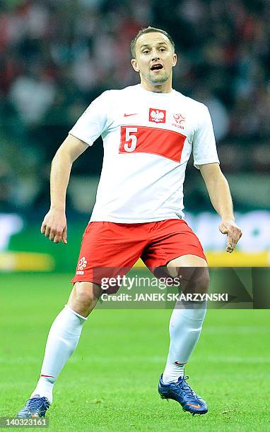 Poland's Dariusz Dudka looks at the ball during the friendly football match against Portugal on February 29, 2012 in Warsaw. AFP PHOTO/JANEK...
