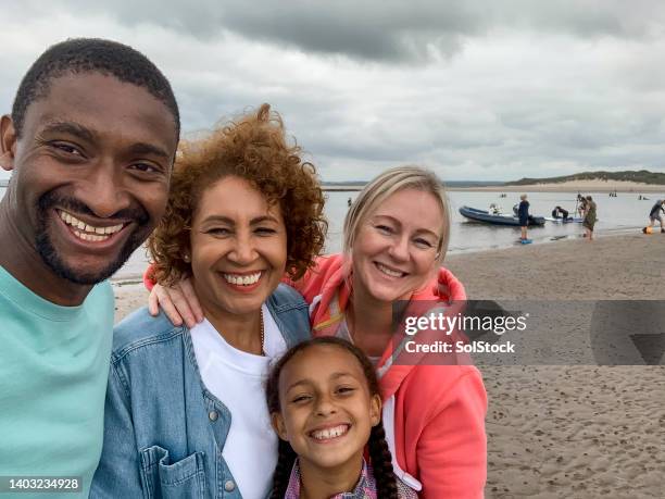 one big happy family - beach black and white stock pictures, royalty-free photos & images