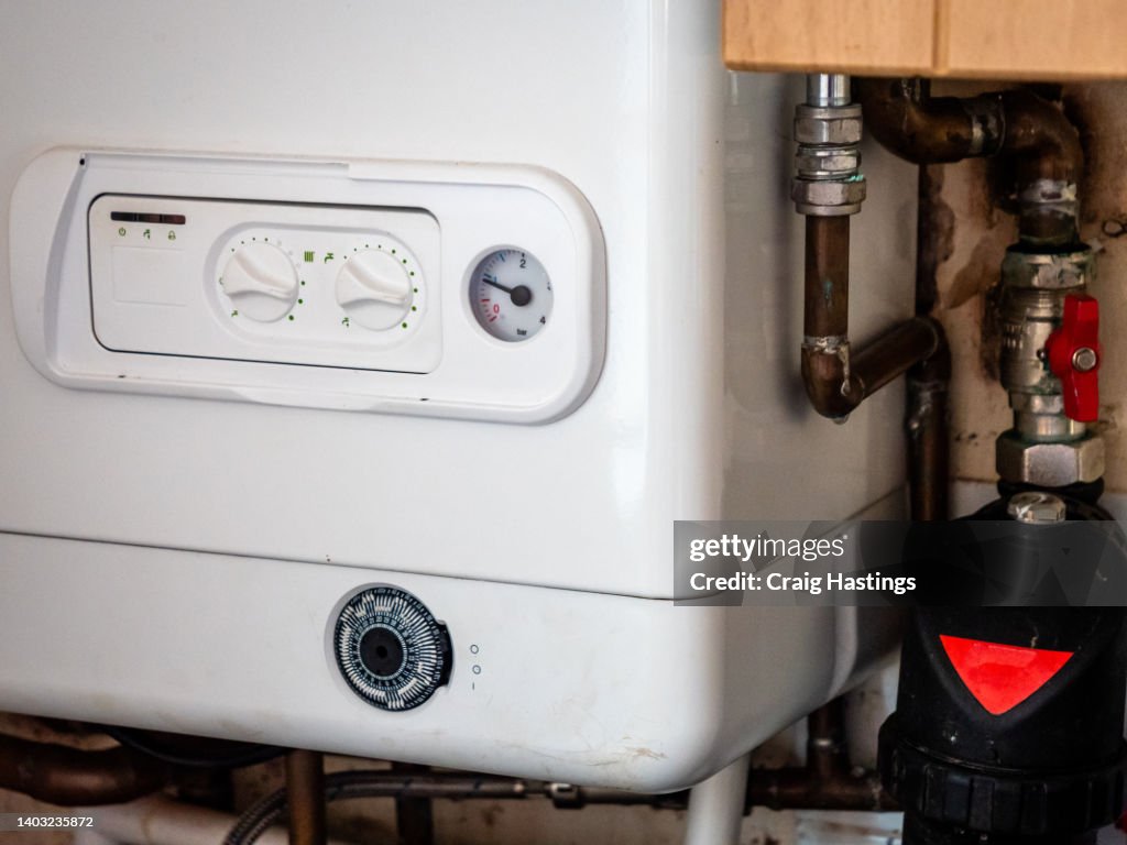 Small to Medium Combi Boiler heating system found in typical family home terrace house in UK.