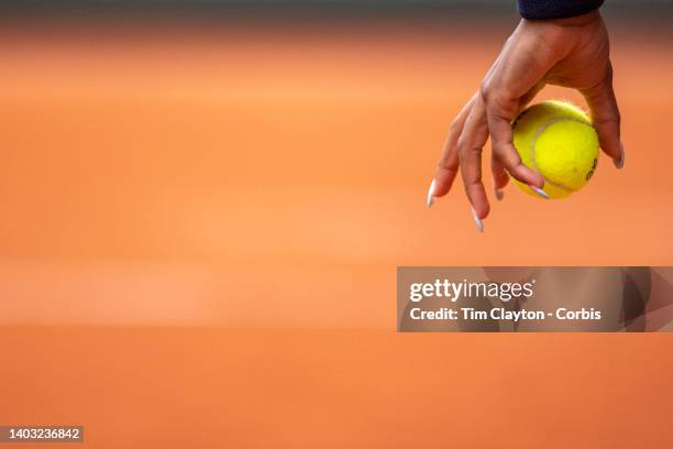 The hand of Coco Gauff of the United States bouncing the ball as she prepares to serve while in action along with Jessica Pegula of the United States...