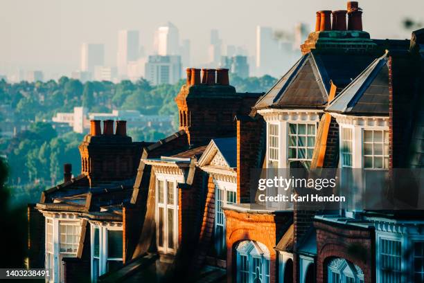 a sunrise view of muswell hill in london - canary wharf in the background - hill street stock pictures, royalty-free photos & images