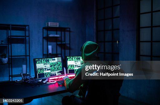 Hacker Man Working On Computers In Dark Room Rear View High-Res Stock ...