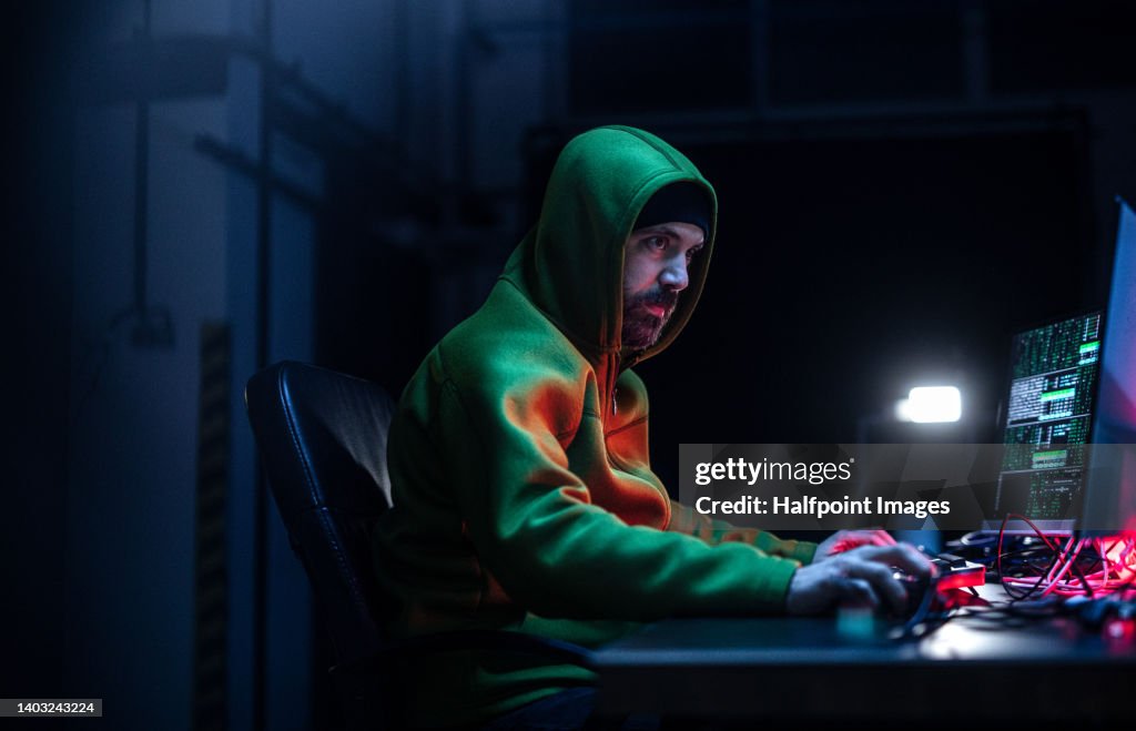 Hackerman With Many Computers Hacker Man Working On Computers In Dark Room Side View High-Res Stock ...