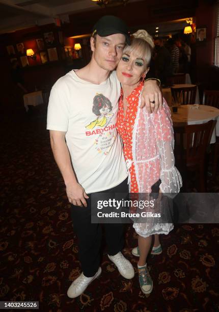 Alfie Allen and Tracie Bennett pose as Allen is presented with a caricature honoring Allen's work in his broadway debut in the play "Hangmen" on...