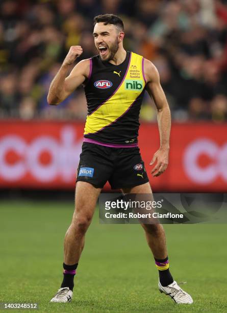 Shane Edwards of the Tigers celebrates after scoring a goal during the round 14 AFL match between the Richmond Tigers and the Carlton Blues at...