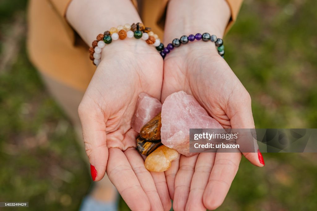 Young Woman Holding Crystals