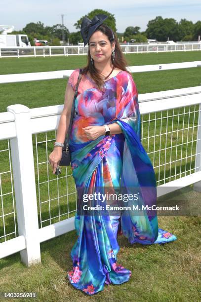 Racegoers wearing a saree poses for photographs during Royal Ascot 2022 at Ascot Racecourse on June 16, 2022 in Ascot, England.