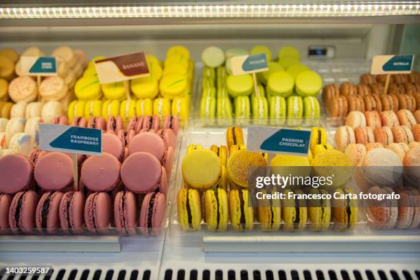 colorful macaroons - bakery window stock pictures, royalty-free photos & images