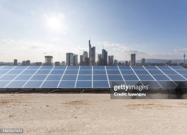 solar panels with skyscraper,singapore - solar panel city stock-fotos und bilder