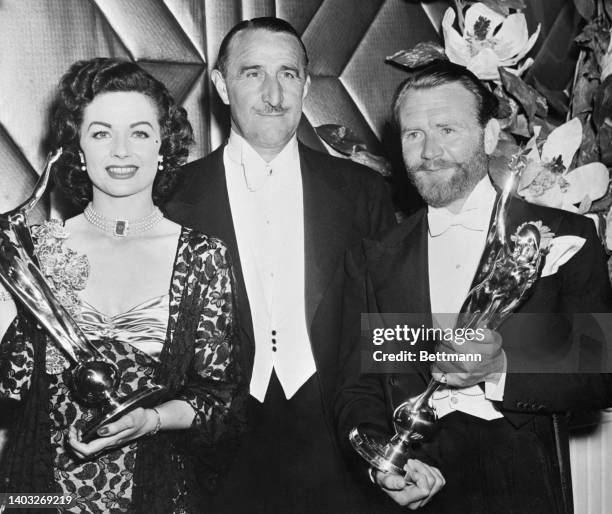 Margaret Lockwood and J. Arthur Rank aAnd John Mills pose with their Daily Mail Film Awards.