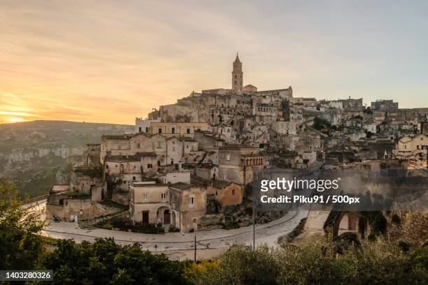 high angle view of townscape against sky during sunset,matera,prowincja matera,italy - matera stock pictures, royalty-free photos & images
