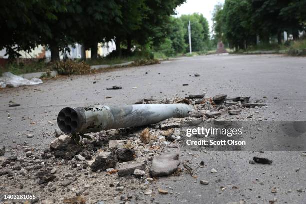 Missile is lodged in the pavement of a street on June 16, 2022 in Lysychansk, Ukraine. Few residents remain in the city as it undergoes frequent...