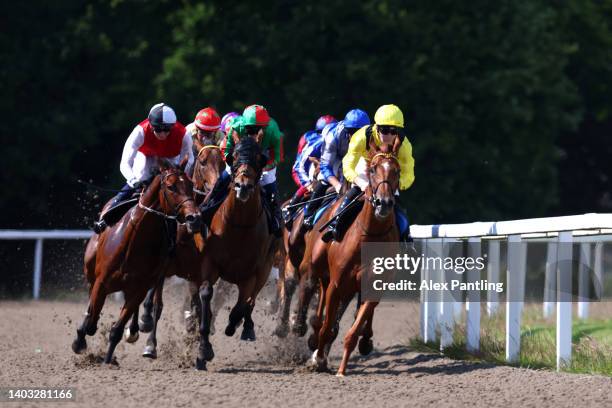 Horses race in the Racing Welfare Handicap Stakes at Chelmsford City Racecourse on June 16, 2022 in Chelmsford, England.