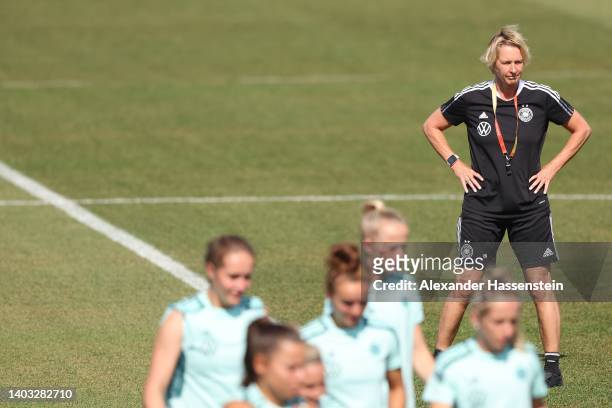 Martina Voss-Tecklenburg, head coach of Germany looks on during a trainig session of the German Women's national soccer team during the media day of...