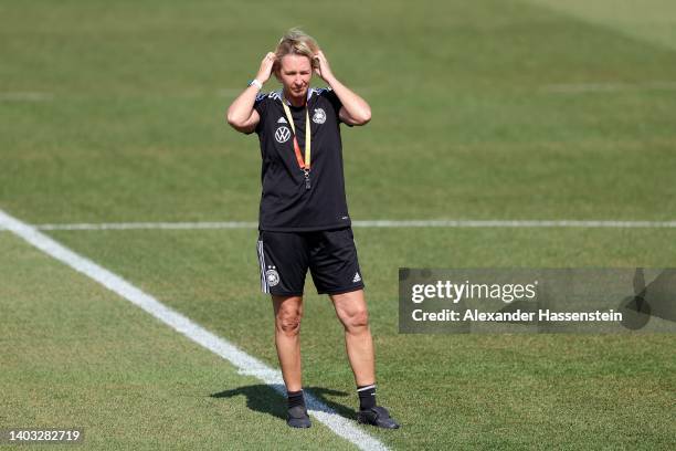 Martina Voss-Tecklenburg, head coach of Germany looks on during a trainig session of the German Women's national soccer team during the media day of...