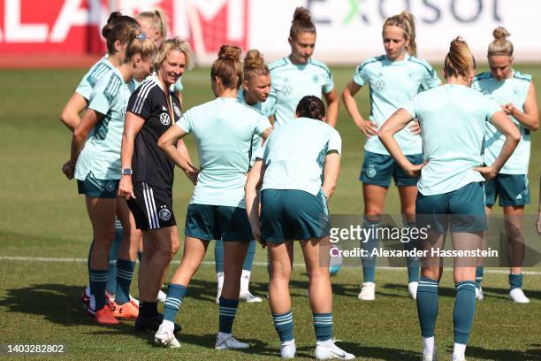 Martina Voss-Tecklenburg, head coach of Germany talks to the team during a training session of the German Women's national soccer team during the...