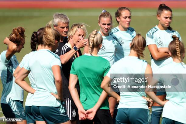 Martina Voss-Tecklenburg, head coach of Germany talks to the team during a training session of the German Women's national soccer team during the...