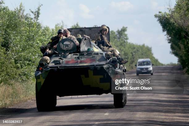 Troops ride on a military vehicle on June 16, 2022 near Lysychansk, Ukraine. In recent weeks, Russia has concentrated its firepower on Ukraine's...