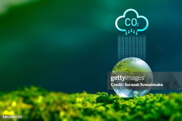 sustainable business with the planet through renewable energy and green co2 emissions, whereby using renewable energy can limit climate change and global warming. - kohlendioxid stock-fotos und bilder