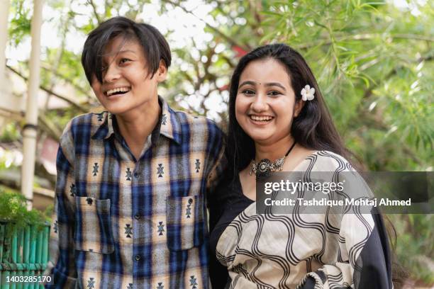 young same sex couple posing for the camera. - indian lesbian stock pictures, royalty-free photos & images