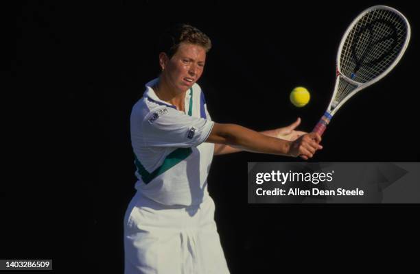 Jo Durie from Great Britain keeps her eye on the tennis ball playing a backhand return against Akemi Nishiya of Japan during their Women's Singles...