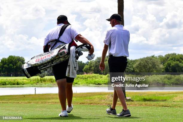 Owen Burt of the Huntingdon College Hawks walks the course during the Division III Men's Golf Championship held at The Mission Inn Resort and Club on...