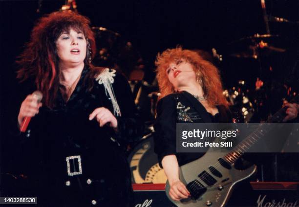 Nancy Wilson and Ann Wilson of American rock band Heart perform on stage at Wembley Arena on March 6th, 1988 in London, England.