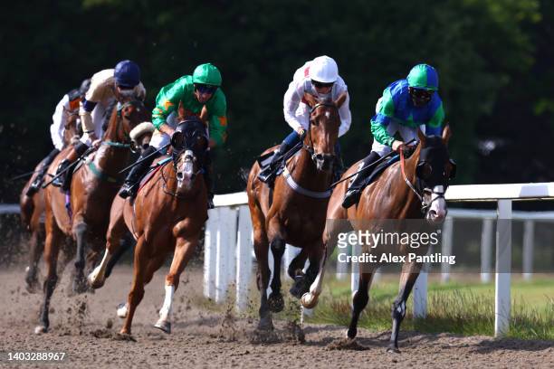 Mukha Magic ridden by Robert Tart leads the way in the Lady Deborah Hayward Handicap Stakes at Chelmsford City Racecourse on June 16, 2022 in...
